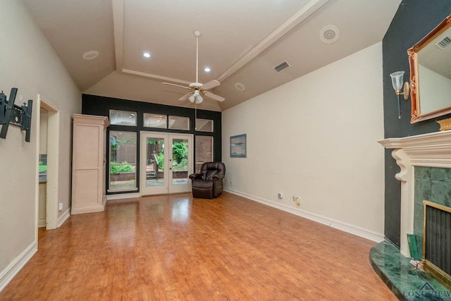 315 Tealwood Dr, Longview, TX 75605 - unfurnished living room featuring wood finished floors, a fireplace, ceiling fan, french doors, and recessed lighting