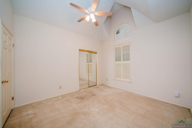 315 Tealwood Dr, Longview, TX 75605 - unfurnished bedroom featuring carpet flooring, high vaulted ceiling, a closet, and a ceiling fan