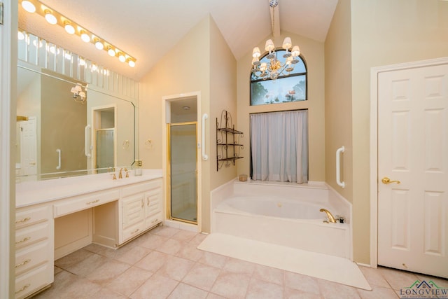 315 Tealwood Dr, Longview, TX 75605 - bathroom featuring lofted ceiling, a chandelier, vanity, a garden tub, and a stall shower