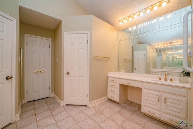 315 Tealwood Dr, Longview, TX 75605 - bathroom with tile patterned floors, vanity, and a closet