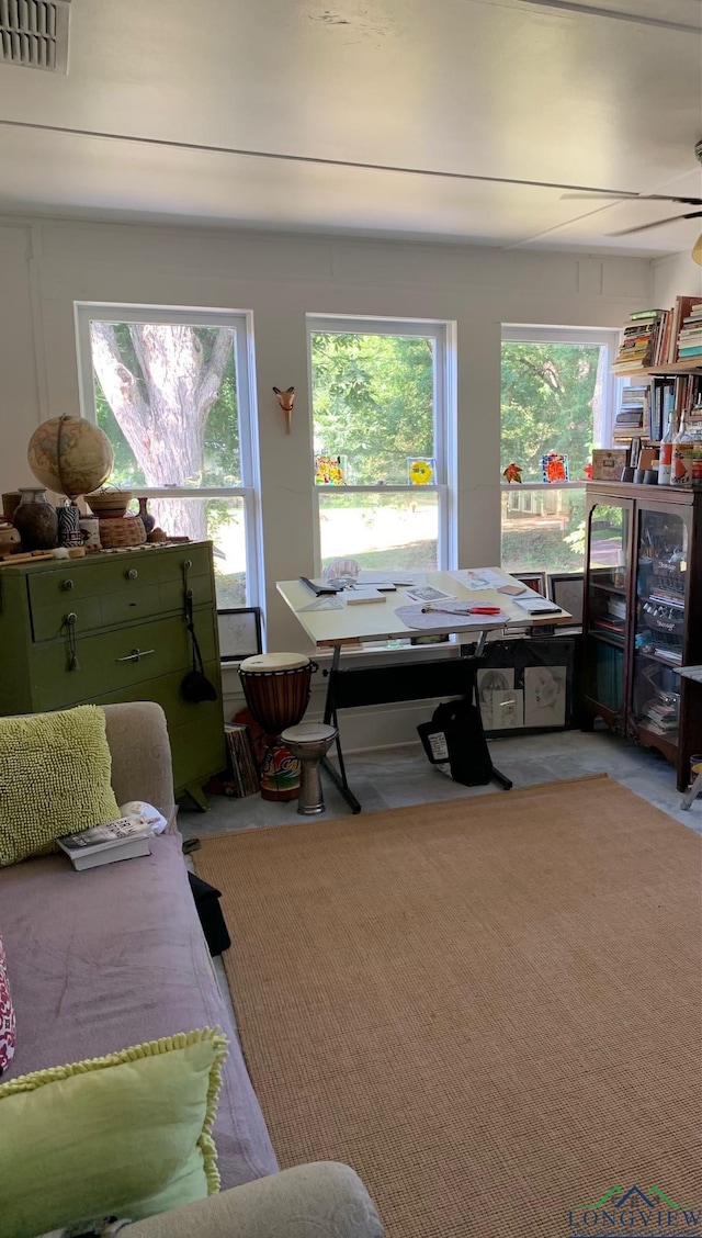 interior space featuring ceiling fan