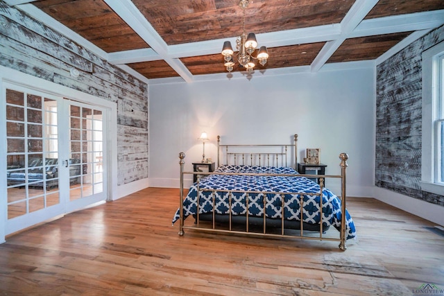 bedroom featuring beam ceiling, french doors, and coffered ceiling