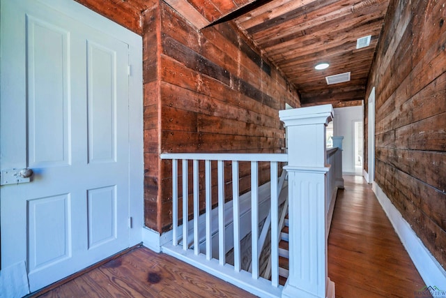 hallway with wooden ceiling and dark hardwood / wood-style flooring