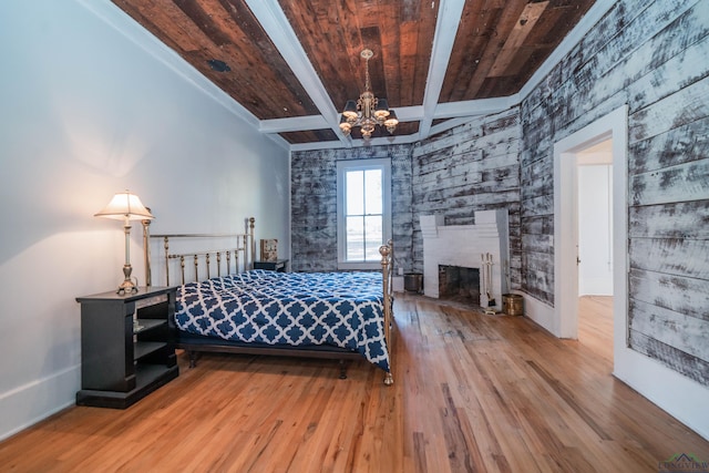 unfurnished bedroom featuring a chandelier, wood ceiling, beam ceiling, and hardwood / wood-style flooring