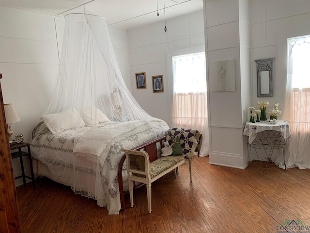 bedroom with hardwood / wood-style floors