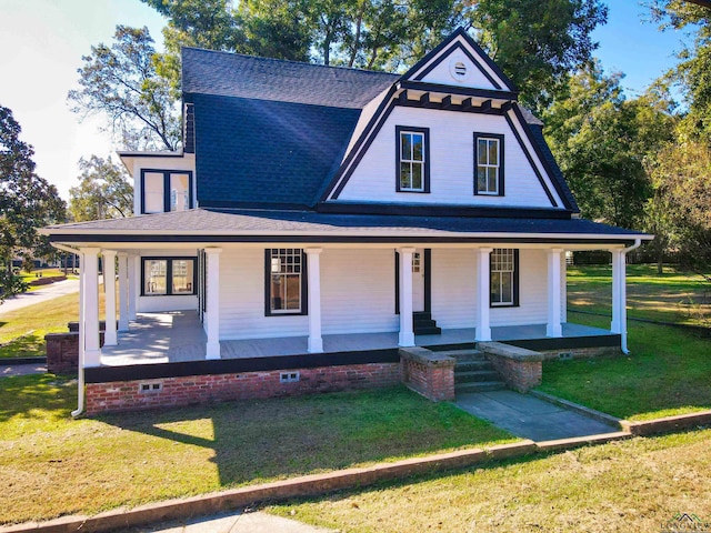 view of front of home featuring a front yard and covered porch