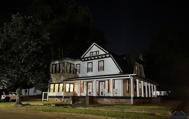 back house at night with covered porch