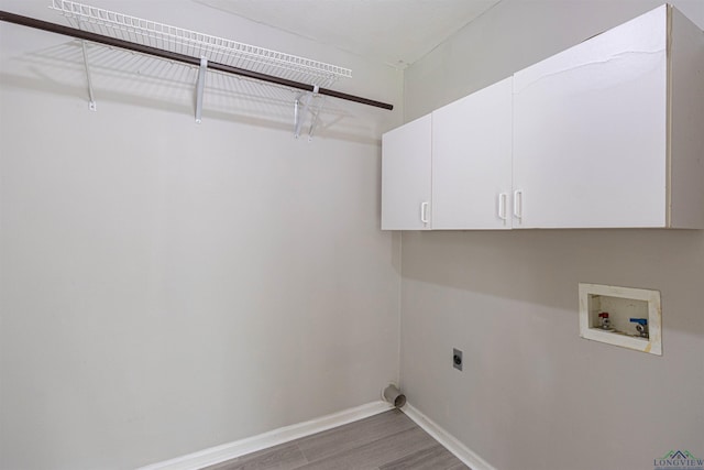 524 N College St, Lindale, TX 75771 - laundry area with wood finished floors, washer hookup, hookup for an electric dryer, and cabinet space
