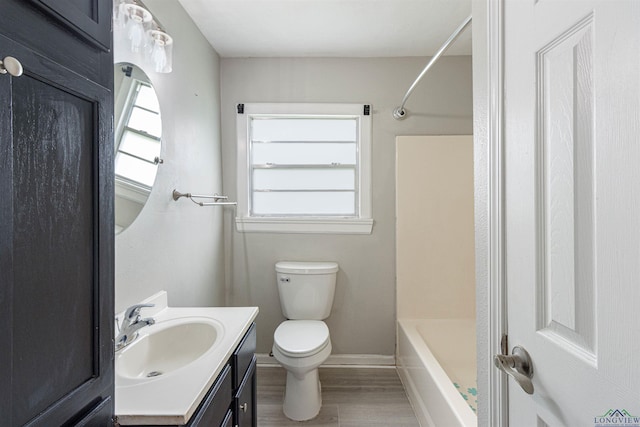 524 N College St, Lindale, TX 75771 - full bathroom featuring vanity, wood finished floors, and bathing tub / shower combination