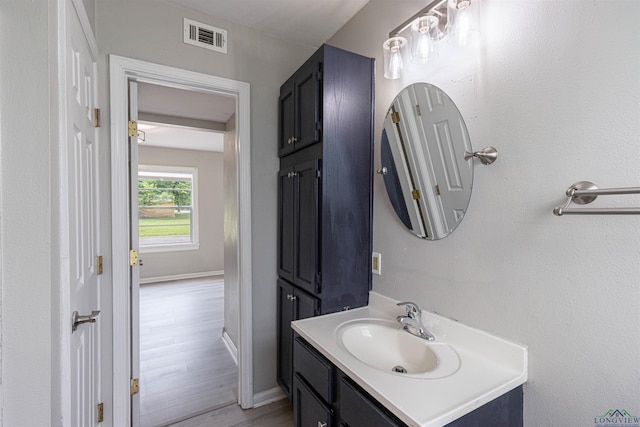 524 N College St, Lindale, TX 75771 - bathroom featuring vanity and wood finished floors