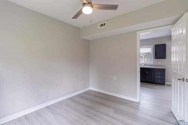 524 N College St, Lindale, TX 75771 - spare room with light wood-style floors and ceiling fan