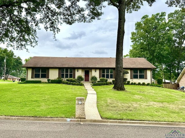 3201 Restview St, Longview, TX 75605 - ranch-style house with a front lawn and brick siding