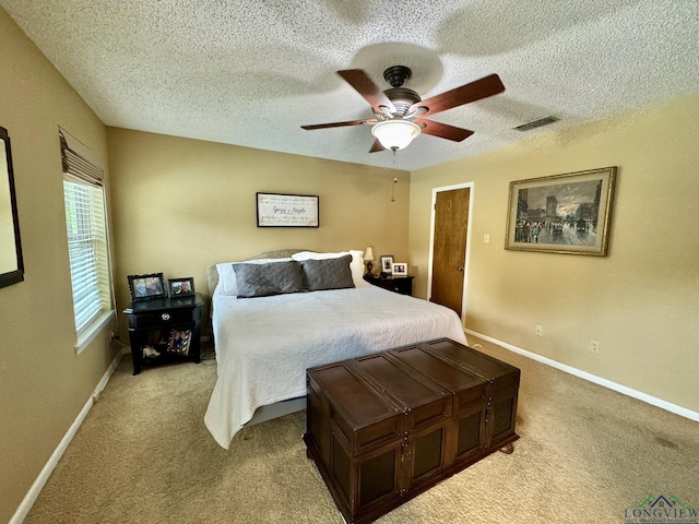 3201 Restview St, Longview, TX 75605 - bedroom featuring light carpet, a textured ceiling, ceiling fan, and baseboards