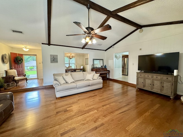 3201 Restview St, Longview, TX 75605 - living area with wood finished floors, ceiling fan, and a chandelier