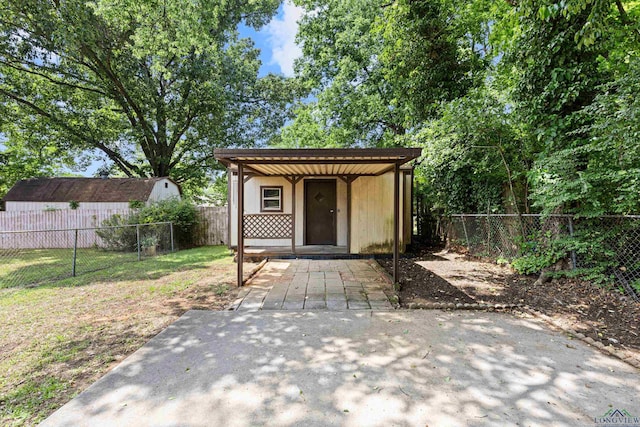 view of outbuilding featuring an outdoor structure and a fenced backyard