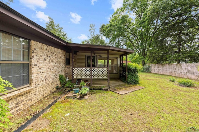 view of yard featuring fence and a patio area