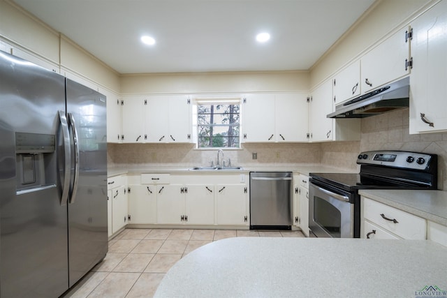 kitchen with appliances with stainless steel finishes, backsplash, a sink, and under cabinet range hood