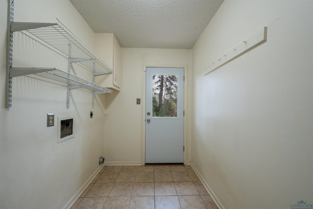 laundry room with washer hookup, light tile patterned floors, electric dryer hookup, a textured ceiling, and laundry area