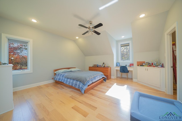 bedroom with light wood-type flooring, ceiling fan, and lofted ceiling