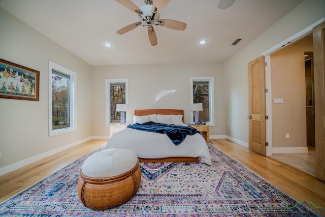 bedroom with ceiling fan and light wood-type flooring