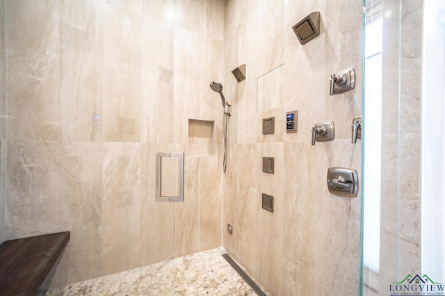 bathroom featuring tiled shower