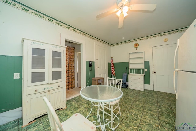 508 N Soda St, Jefferson, TX 75657 - dining space featuring a ceiling fan and dark floors