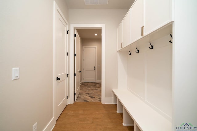 mudroom featuring baseboards, recessed lighting, visible vents, and light wood-style flooring