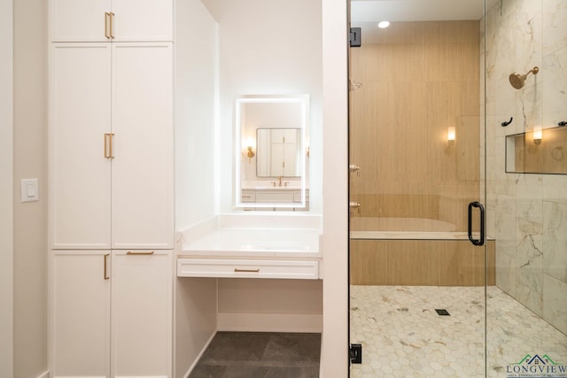 bathroom featuring a sink and a stall shower