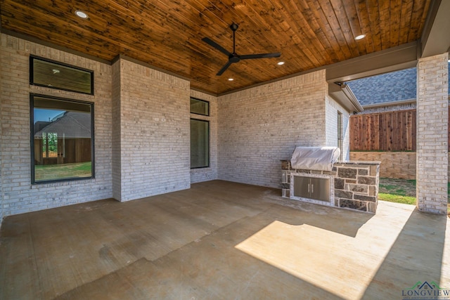 view of patio featuring an outdoor kitchen, ceiling fan, and area for grilling