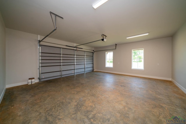 garage featuring baseboards and a garage door opener