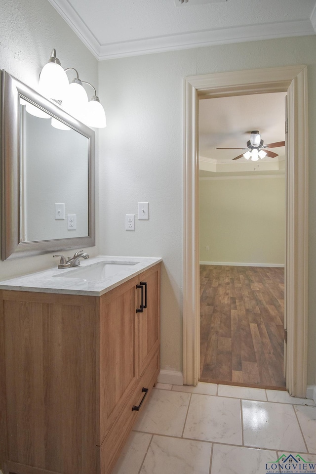 bathroom with vanity, ceiling fan, and crown molding