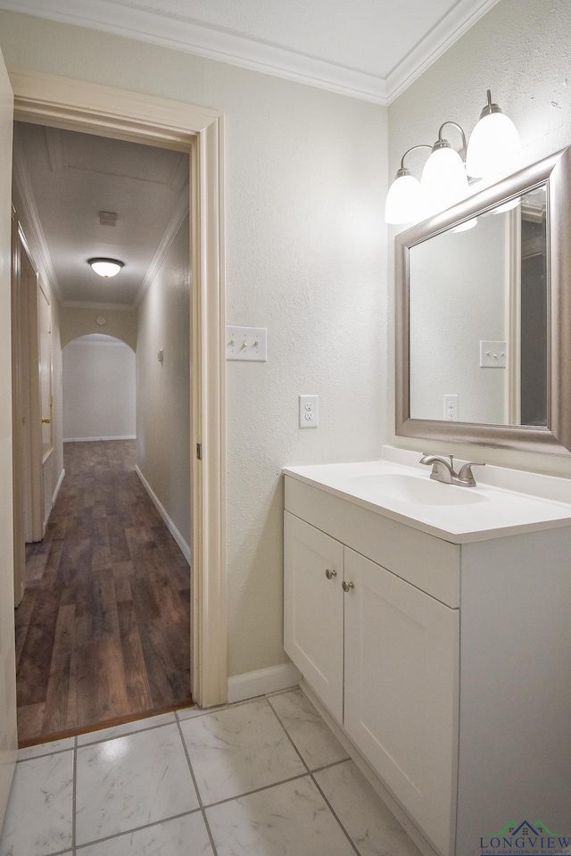 bathroom with vanity and crown molding