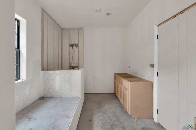 bathroom with concrete floors