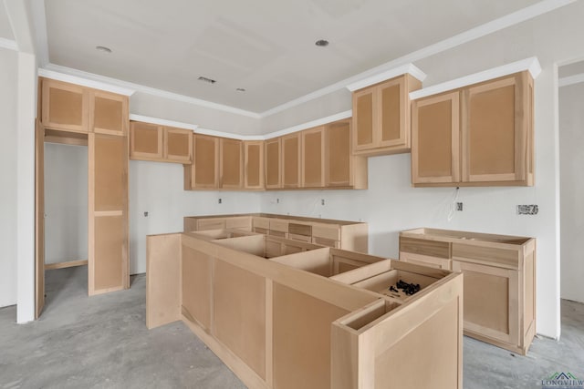 kitchen featuring a kitchen island and crown molding