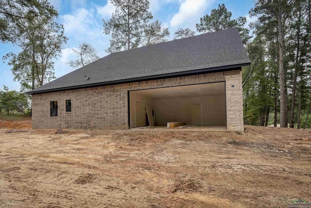 view of side of property with a garage