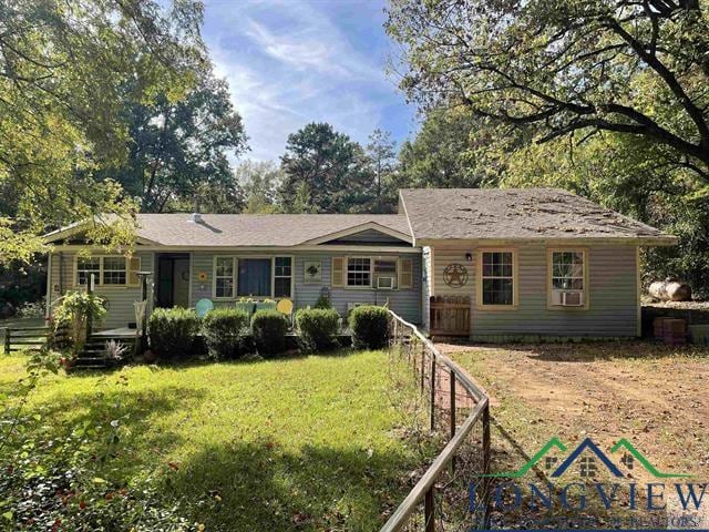 ranch-style house with a front lawn