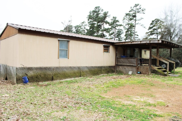 view of home's exterior featuring metal roof