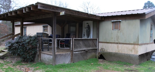 view of side of property with metal roof