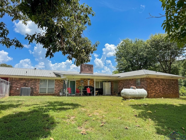 1226 County Road 1896, Linden, TX 75563 - back of property featuring a chimney, a yard, and brick siding