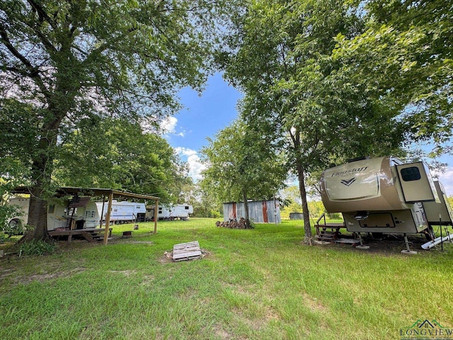 1226 County Road 1896, Linden, TX 75563 - view of grassy yard featuring an outbuilding