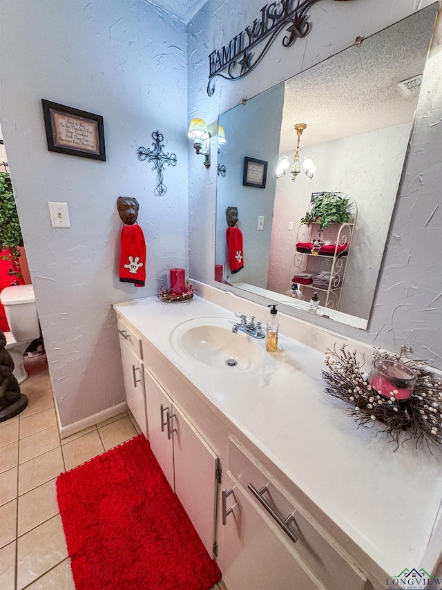 1226 County Road 1896, Linden, TX 75563 - bathroom with tile patterned flooring, vanity, and a chandelier