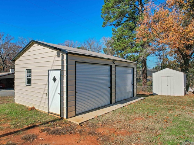 garage featuring a yard