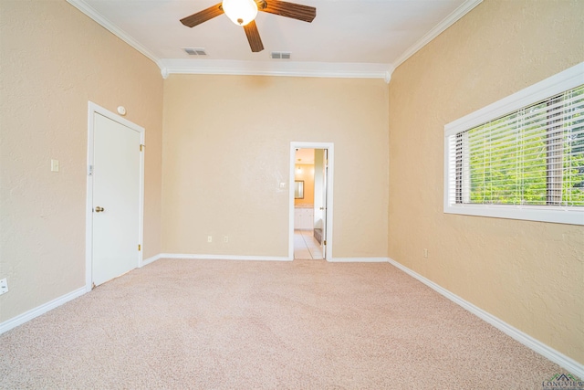 1822 Northwood Ct, Longview, TX 75604 - unfurnished bedroom featuring crown molding, light colored carpet, a textured wall, ceiling fan, and baseboards