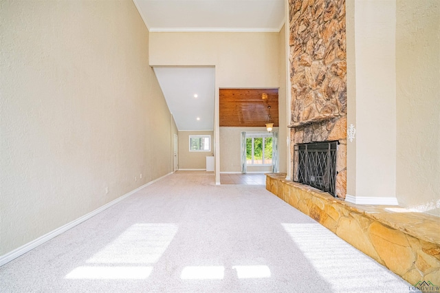 1822 Northwood Ct, Longview, TX 75604 - unfurnished living room with a stone fireplace, carpet floors, crown molding, and baseboards