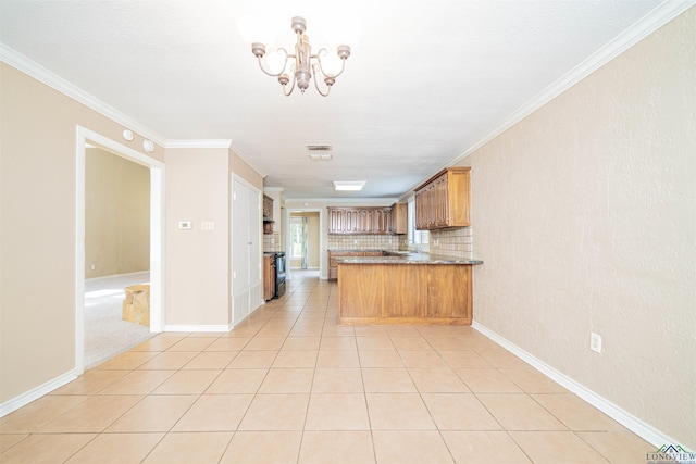 1822 Northwood Ct, Longview, TX 75604 - kitchen with a peninsula, a chandelier, brown cabinets, crown molding, and light tile patterned floors