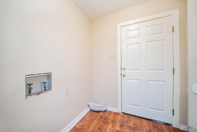 1822 Northwood Ct, Longview, TX 75604 - washroom featuring washer hookup, wood finished floors, and baseboards