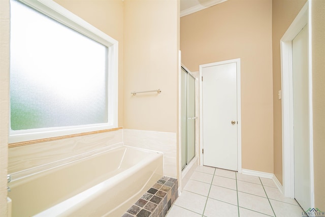 1822 Northwood Ct, Longview, TX 75604 - bathroom with a garden tub, a stall shower, and tile patterned floors