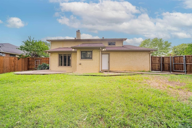 1822 Northwood Ct, Longview, TX 75604 - back of property with a patio area, a chimney, and stucco siding