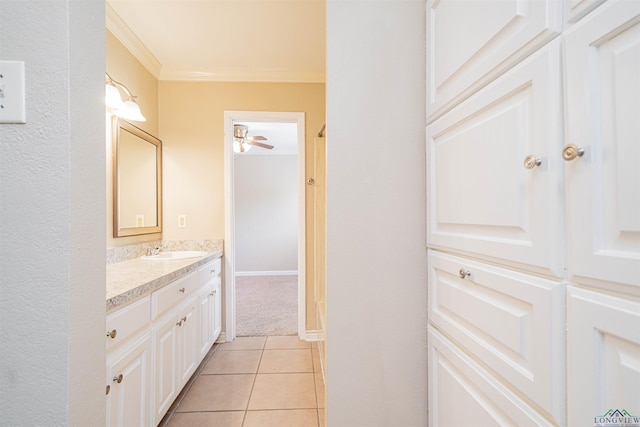 1822 Northwood Ct, Longview, TX 75604 - bathroom with ornamental molding, vanity, a ceiling fan, and tile patterned flooring