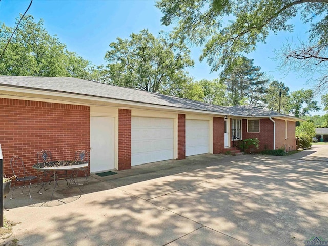 exterior space with concrete driveway
